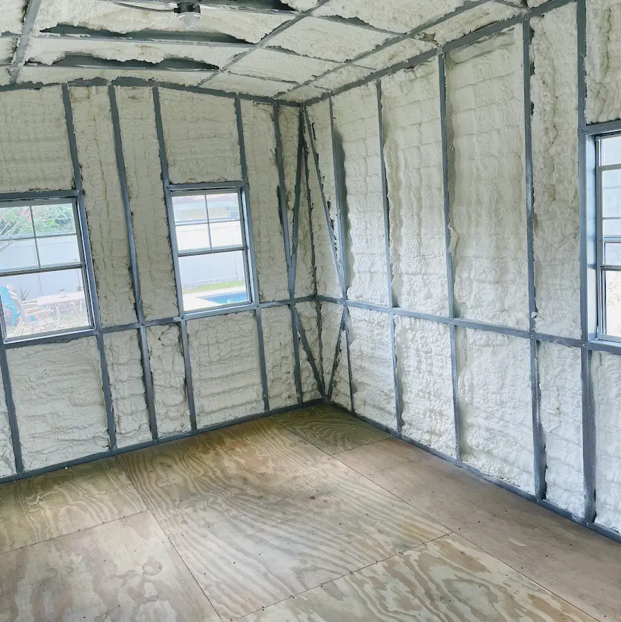 Closed-cell spray foam insulation applied to wall cavities in a residential project in Baxter